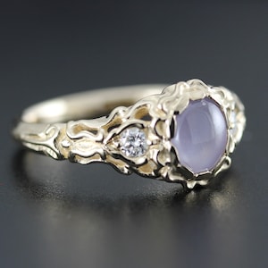 Star Sapphire ring with diamonds, sculpted design, 14k yellow gold, bezel set. 1.66 carat star sapphire, 0.12 ct tw natural diamonds