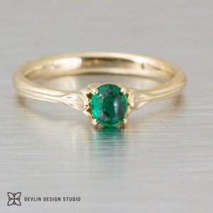 emerald ring, cabochon oval 14k yellow with leaf accents