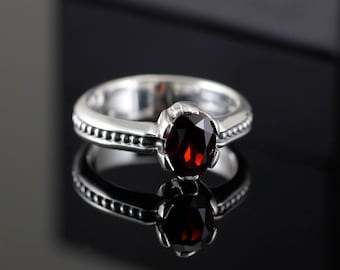 Garnet ring, sterling silver, oval prong set