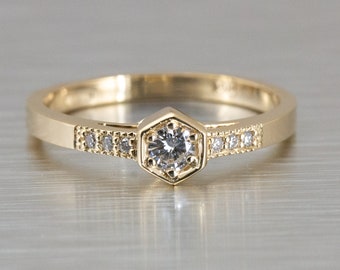 Hexagon shaped ring with round diamonds