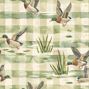 May include: A repeating pattern featuring watercolor mallard ducks in flight, interspersed with green reeds and lily pads. The background consists of a soft, light-colored grid or plaid design in muted shades of cream and sage green.