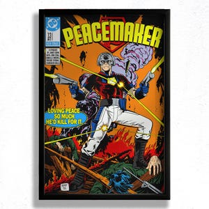 May include: A framed comic book cover featuring the character Peacemaker. The artwork depicts Peacemaker in a red, blue, and white costume, holding two guns. The cover includes the text "Peacemaker" and the tagline "Loving Peace So Much He'd Kill For It."