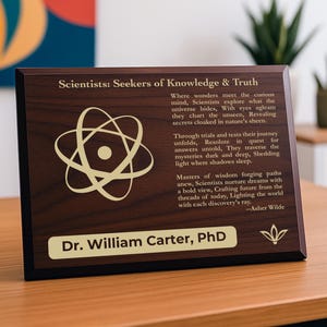 May include: A wooden plaque with the text "Scientists: Seekers of Knowledge & Truth" and an atom symbol. The plaque also includes the name "Dr. William Carter, PhD". The plaque is on a wooden surface.