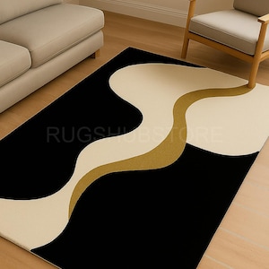 May include: A rectangular rug with a modern design. The rug features a black background with a cream-colored and gold wavy pattern. The text "RUGSHUBSTORE" is visible on the rug.
