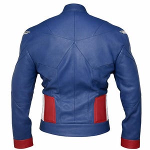 May include: A blue leather jacket with red and white accents. The back of the jacket features a star-shaped design and red panels on the lower back. The sleeves have red cuffs, and there are silver shoulder details. A stylish outerwear piece.