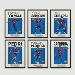 May include: Six framed FC Barcelona football player posters. Each poster features a player's name, number, and image against a blue background. Players include Lamine Yamal, Robert Lewandowski, Pau Cubarsí, Pedri, Marcus Rashford, and Raphinha.