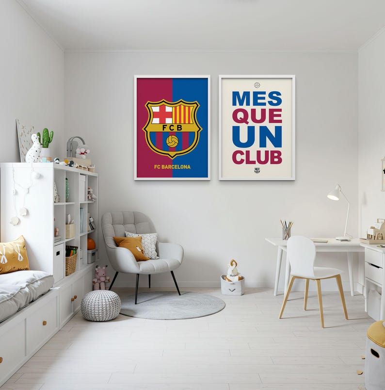 May include: Two framed posters with white borders. One features the FC Barcelona logo on a blue and maroon background, with "FC Barcelona" below. The other poster says "MES QUE UN CLUB" in blue and maroon text on a cream background.