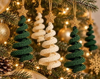May include: A collection of spiral-shaped Christmas tree ornaments crocheted from yarn. Each ornament features a textured green or cream-coloured body topped with a small, crocheted gold star and finished with a tiny gold bead at the base.