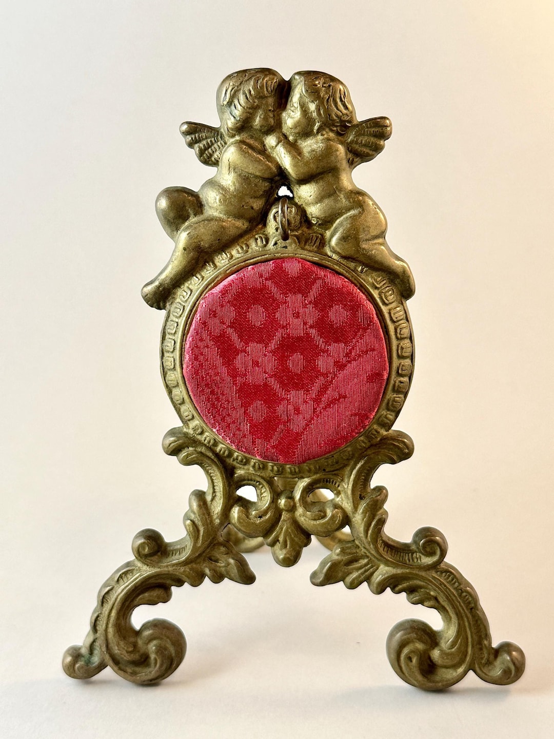 antique-french-brass-pocket-watch-stand-with-cherub-motif-bronze-easel