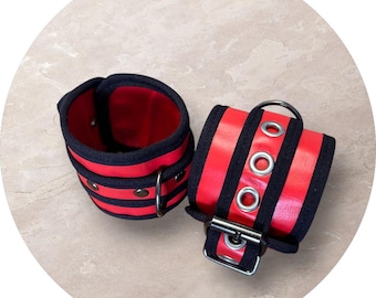 Wurst Band Cuffs. Red color. Faux Leather.