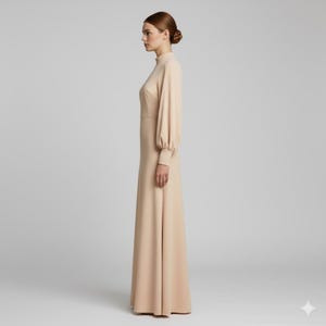 May include: A long, beige dress with a high neckline and long sleeves. The dress has a fitted bodice and a flowing skirt. The sleeves are gathered at the wrist. The dress is made of a smooth, solid fabric and is suitable for formal occasions.