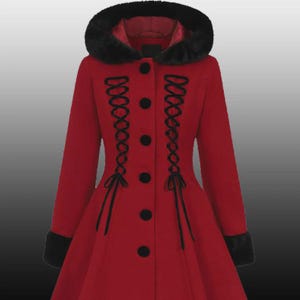 May include: A red coat with a black faux fur-lined hood and cuffs. The coat features black buttons and decorative black lacing down the front. The coat has a flared skirt and long sleeves.
