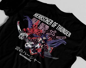 May include: A black t-shirt featuring a graphic print of an anime-style character with long purple hair holding a sword. The design includes red mechanical elements, a pink grid background, and the text HERRSCHER OF THUNDER and ELVENSHOPZ.