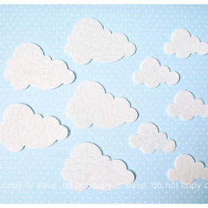May include: Teal blue leather with an embossed floral pattern. The pattern is raised and has a distressed look.