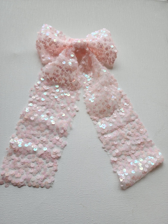 Sequin lace hairbow with long tails in pale pink