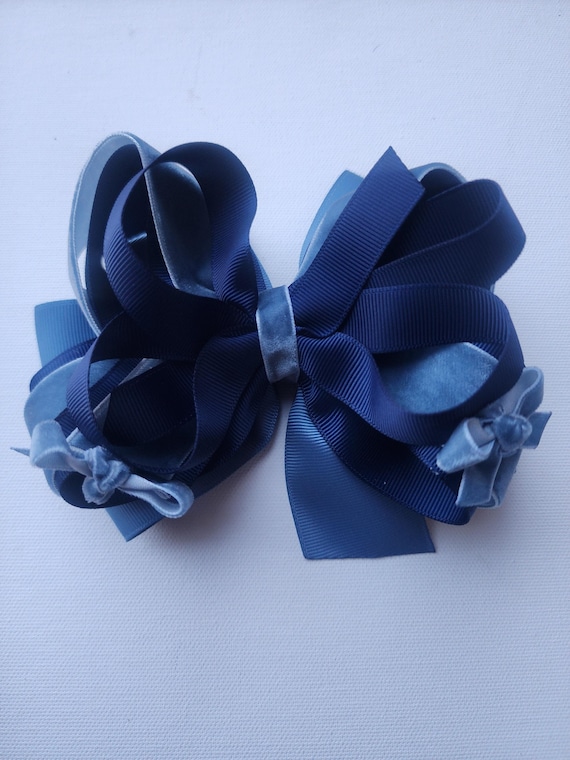 Six  inch triple specialty bow with layers of grosgrain and velvet