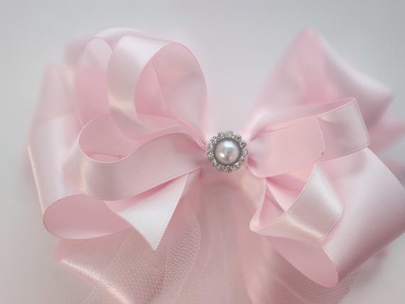6 inch satin hairbow with layers of satin ribbon and tulle.