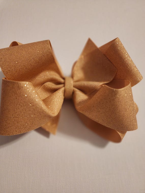 8 inch gold glitter double bow!  Stiff and crispy