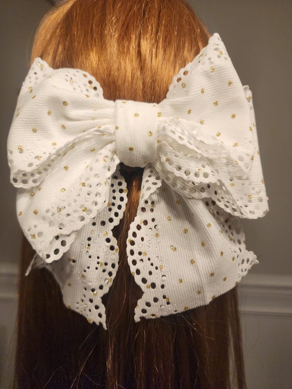 Cream Scalloped edge corduroy bow with gold dots and tails