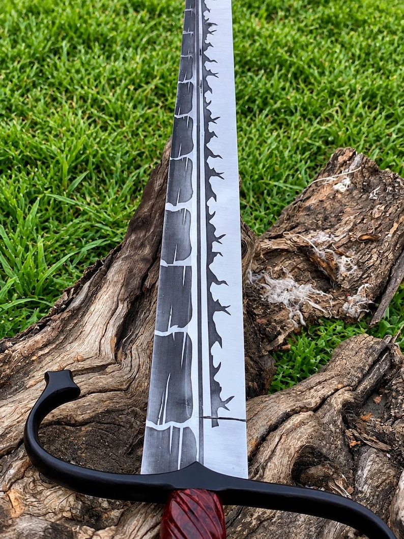May include: A sword with a long, double-edged blade featuring a dark, cracked-pattern finish on one side and a jagged, thorn-like design along the center ridge. The hilt has a black metal crossguard and a dark, spiraled, reddish-brown handle.