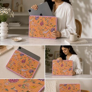 May include: Orange floral patterned tablet sleeve with a pink and white border. The sleeve is made of a textured fabric and features a colorful floral design with purple, yellow, and green accents. The tablet sleeve is shown with a tablet inside.