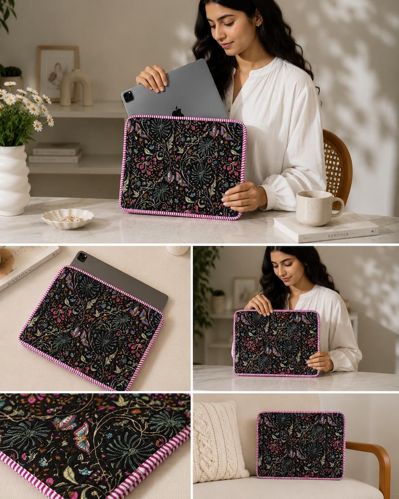 May include: Black tablet sleeve with a colorful floral pattern featuring pink, blue, and green accents. The sleeve has a pink and white striped border. The sleeve is designed to hold a tablet.