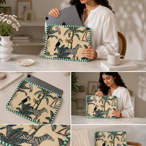 May include: A beige tablet sleeve with a green and white striped border. The sleeve features a jungle scene with zebras, toucans, and palm trees. The tablet is being inserted into the sleeve.