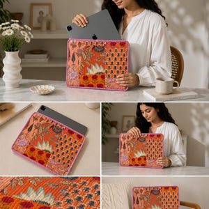 May include: An orange and floral patterned tablet sleeve with a pink stitched border. The sleeve is holding a gray tablet. The design includes various floral and geometric patterns in shades of orange, pink, and blue.
