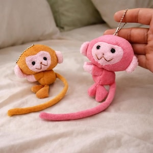 May include: A white ceramic mug with a black handle and the text "But First, Coffee" in a black, bold font. The mug is on a white surface.