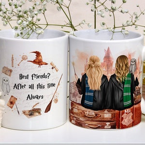 May include: Two white ceramic mugs with a Harry Potter theme. One mug features a Hogwarts castle scene with two girls in robes and a snowy owl. The other mug has a white background with the text "Best Friends? After all this time Always" and Harry Potter themed illustrations.
