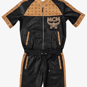 Premium genuine leather two-piece outfit for men in tan and black color combination with zipper details.