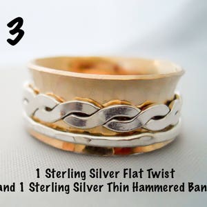 May include: A silver ring with a hammered band and a flat twist band. The ring is made of sterling silver.