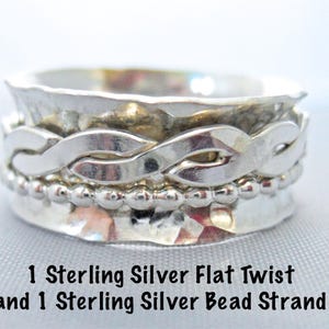 May include: A silver ring with a twisted band and a row of beads. The ring is made of sterling silver and has a hammered finish. 1 Sterling Silver Flat Twist and 1 Sterling Silver Bead Strand.