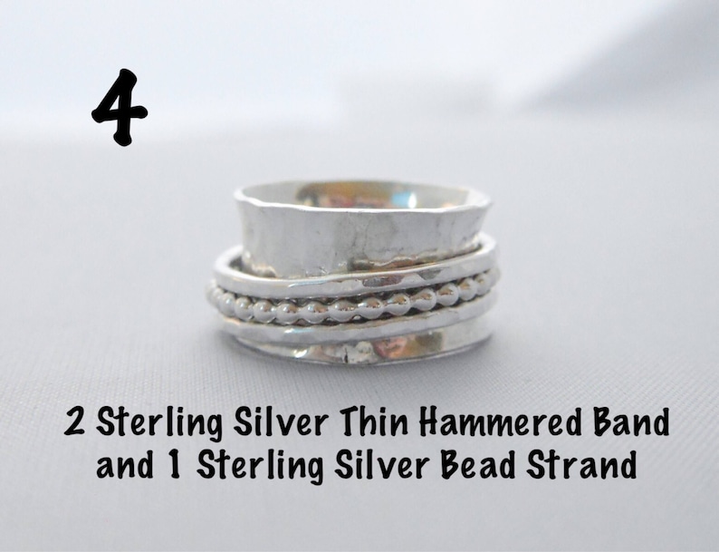 May include: A silver ring with two thin hammered bands and a silver bead strand. The ring is on a white surface. The number 4 is written above the ring.