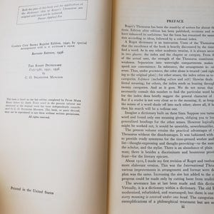May include: An open book displaying the copyright page on the left and the preface on the right. The text includes Garden City Books Reprint Edition 1940, Revised Edition 1936, The Roget Dictionary, and C. O. Sylvester Mawson. The pages are off-white.