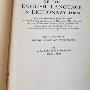 May include: The title page of Roget's Thesaurus of the English Language in Dictionary Form by C. O. Sylvester Mawson, Litt.D., Ph.D., published by Garden City Books, Garden City, New York, featuring black text on a cream-coloured paper page.