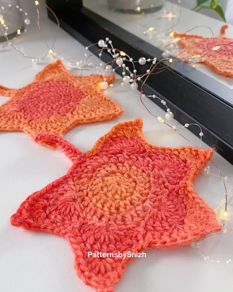 Large crochet maple leaf coaster made with ombré autumn yarn. Handmade fall home décor perfect for table settings, seasonal decorations, or as a unique crochet gift