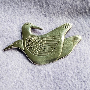 Vintage Laurel Burch twin doves brooch. 1970s. An earlier piece in hammered silver. Signed.