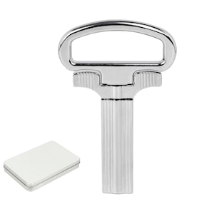 May include: A polished, chrome-finished wine bottle opener with a handle and a ribbed stem. A small, white rectangular tin is next to the opener. The opener is designed for easy cork removal.