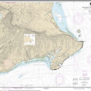May include: A nautical chart titled Southeast Coast of O'ahu, Waimanalo Bay to Diamond Head, featuring detailed topographic contour lines, depth soundings in fathoms, compass roses, and coastal infrastructure markings printed on a large paper sheet.