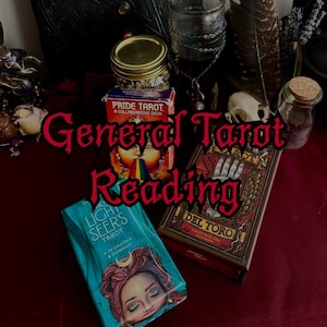 May include: An image featuring tarot decks, including "Pride Tarot" and "Del Toro Tarot." The text "General Tarot Reading" is displayed in a gothic font. Other items include a jar, feathers, and a small skull, suggesting a mystical theme.