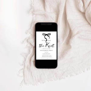 May include: A black smartphone shows a white invitation with black text and a bow graphic. The invitation reads "We're Tying the Knot" and announces an engagement party honouring Kate Wilson.
