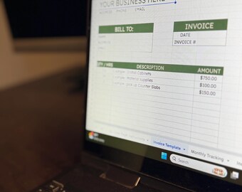 May include: A laptop displaying a spreadsheet invoice template. The screen shows fields for business information, invoice details, and itemized descriptions with amounts. The keyboard is in the foreground.