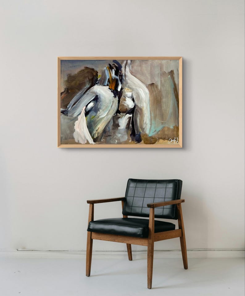 May include: Abstract painting in a wooden frame. The artwork features a blend of white, gray, and brown brushstrokes. Below the painting is a mid-century modern chair with a black leather seat and wooden frame.