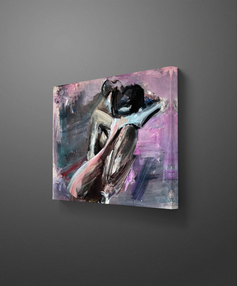 May include: Abstract canvas art depicting figures in black, pink, and grey tones. The painting uses a textured, brushstroke technique, emphasizing form and emotion. The background is a blend of purple and grey.
