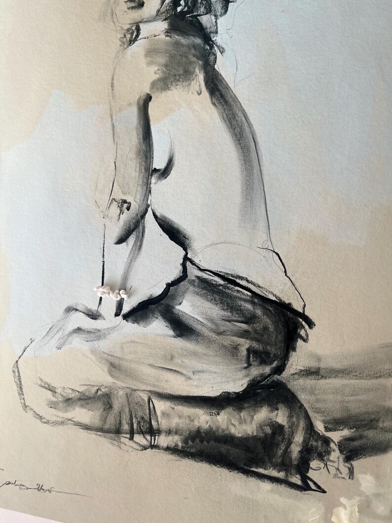 May include: A charcoal sketch of a seated figure, rendered in shades of gray and black. The artwork features bold, expressive strokes, capturing the form and posture of the subject. The figure is positioned in a seated pose, with a focus on the curves and contours of the body.
