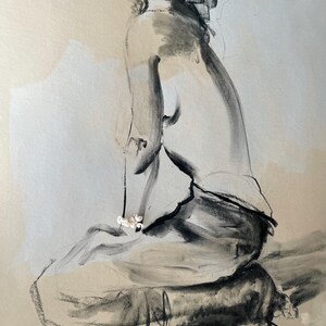 May include: A charcoal sketch of a seated figure, rendered in shades of gray and black. The artwork features a minimalist style with soft shading and highlights, creating a sense of depth and form. The figure is adorned with a delicate necklace.