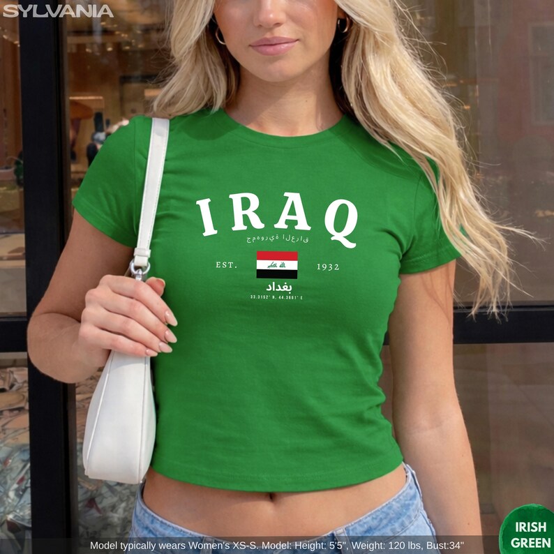 May include: A green t-shirt with the word "IRAQ" in white, along with the Iraqi flag and the text "EST. 1932". The shirt also features Arabic text and the city name "Baghdad".