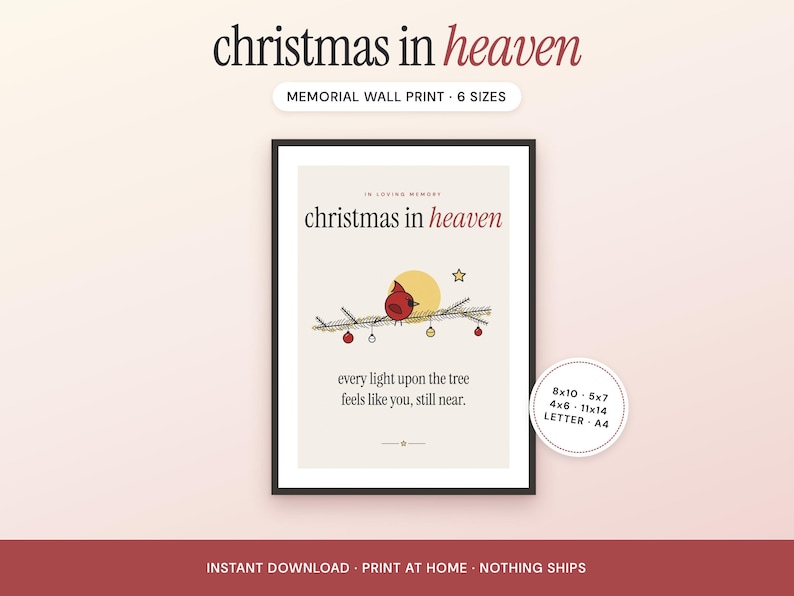 May include: A framed memorial wall print with a cream background featuring a red cardinal perched on a pine branch with ornaments, a yellow sun, and a star. The text reads: In loving memory, christmas in heaven, every light upon the tree feels like you, still near.