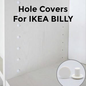 May include: White hole covers for IKEA BILLY shelves. The image shows the covers installed on a light wood shelf and a close-up of the covers. Text on the image reads "Hole Covers For IKEA BILLY".